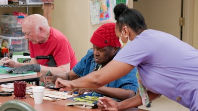 Timberlane Health & Rehab, assisted living in El Dorado, AR — Seniors engaged in a crafting activity with staff assistance