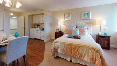 Cozy resident room with a bed and kitchenette