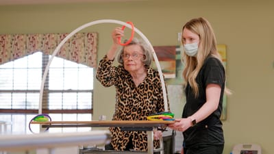 Timberlane Health & Rehab, assisted living in El Dorado, AR — Senior resident engaging in a rehabilitation activity with staff