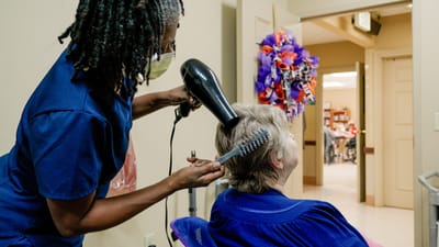 Timberlane Health & Rehab, assisted living in El Dorado, AR — Hair care service being provided in a senior living facility