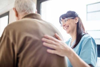 Nurse interacting with a resident in a facility
