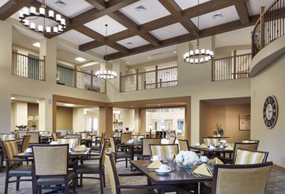 Bright dining room with tables set for a meal