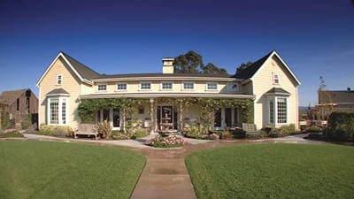 Exterior view of a senior living facility with garden