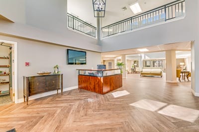 Bright common area with seating and reception desk