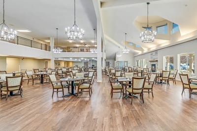 Bright dining room with tables and chairs arranged