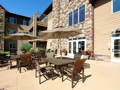 Outdoor seating area with tables and umbrellas