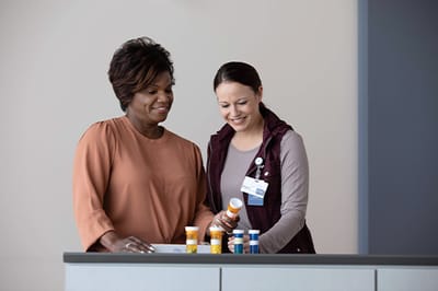 Good Samaritan Society – Mohall, Nursing Home in Mohall, ND — Two women discussing medication at a service counter