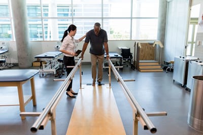 Good Samaritan Society – Mohall, Nursing Home in Mohall, ND — Physical therapy session with a patient and therapist