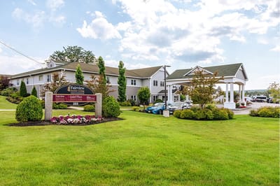 The Inn at Fairview, nursing home in Hudson, NH — Exterior view of The Inn at Fairview with landscaping