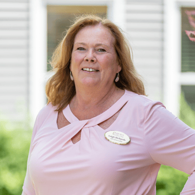 Staff member smiling outside the facility