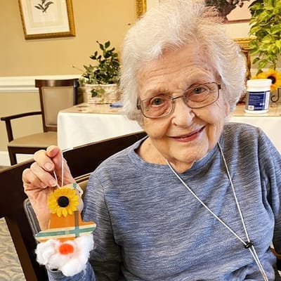 The Inn at Fairview, nursing home in Hudson, NH — Elderly woman holding a decorative craft project