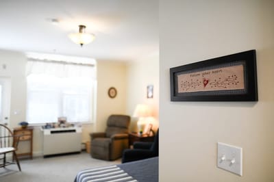 The Inn at Fairview, nursing home in Hudson, NH — Cozy private room with welcoming decor and seating area
