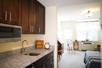The Inn at Fairview, nursing home in Hudson, NH — Cozy kitchen area in a senior living apartment