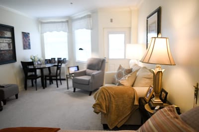 The Inn at Fairview, nursing home in Hudson, NH — Cozy living room with furniture and natural light