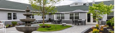 Outdoor courtyard with a fountain and seating
