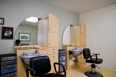 Interior of a salon with styling chairs and mirrors