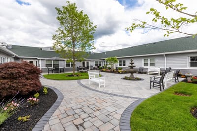 Gardens and seating area in a senior living courtyard