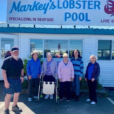 The Inn at Fairview, nursing home in Hudson, NH — Group of seniors posing outside a seafood restaurant