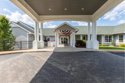 The Inn at Fairview, nursing home in Hudson, NH — Front entrance of a senior living facility with landscaping