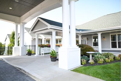 The Inn at Fairview, nursing home in Hudson, NH — Entrance of a senior living facility with landscaping