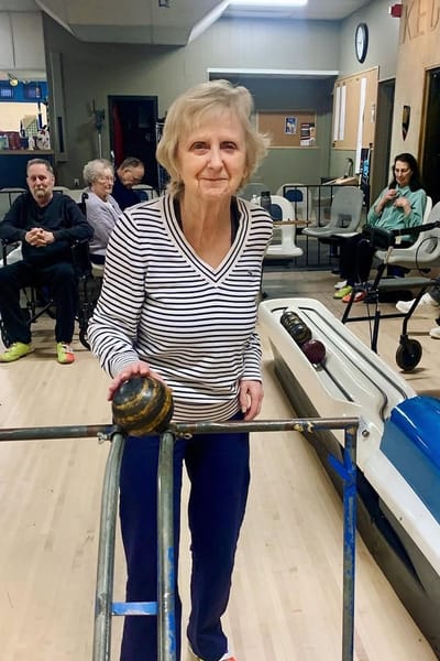 The Inn at Fairview, nursing home in Hudson, NH — Senior resident participating in indoor bowling activity
