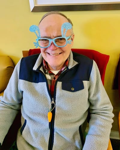 The Inn at Fairview, nursing home in Hudson, NH — Smiling senior man wearing playful decorated glasses