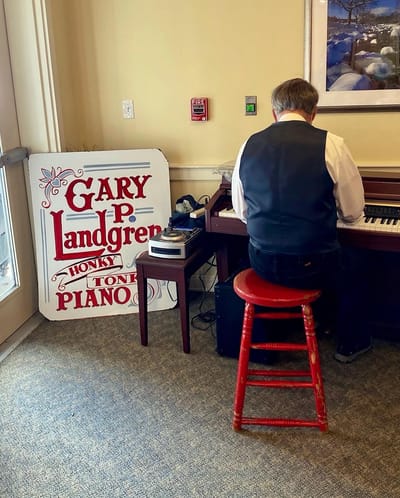 The Inn at Fairview, nursing home in Hudson, NH — Musician playing piano in a senior living facility