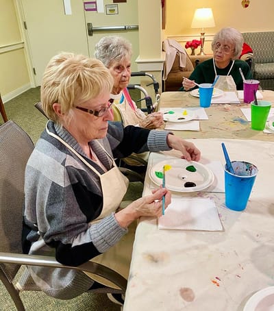 The Inn at Fairview, nursing home in Hudson, NH — Seniors engaged in a painting activity at a table