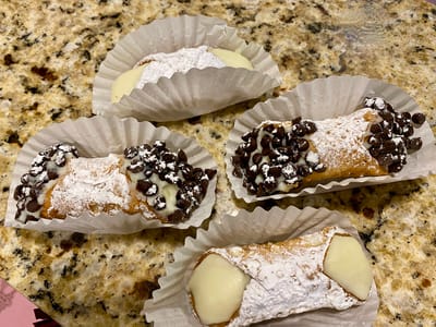The Inn at Fairview, nursing home in Hudson, NH — Cannoli desserts on a marble countertop with paper liners
