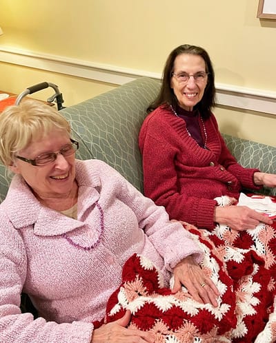 The Inn at Fairview, nursing home in Hudson, NH — Senior residents enjoying leisure time on a couch