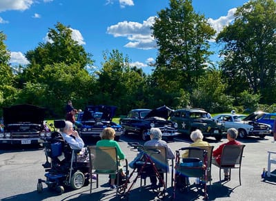 The Inn at Fairview, nursing home in Hudson, NH — Residents enjoying a classic car show outdoors