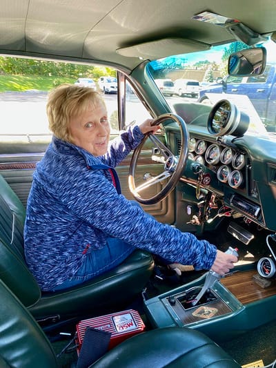 The Inn at Fairview, nursing home in Hudson, NH — Senior woman sitting in a classic car interior