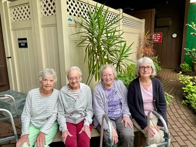 The Inn at Fairview, nursing home in Hudson, NH — Four elderly women seated outdoors with mobility aids