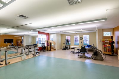 Physical therapy room with exercise equipment
