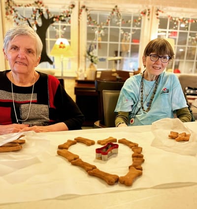 The Inn at Fairview, nursing home in Hudson, NH — Residents crafting heart-shaped treats with dog bone cookies