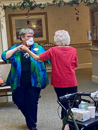 The Inn at Fairview, nursing home in Hudson, NH — Two women dancing in a senior living facility hall