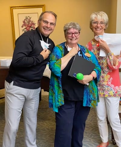 The Inn at Fairview, nursing home in Hudson, NH — Three smiling staff members posing together with documents
