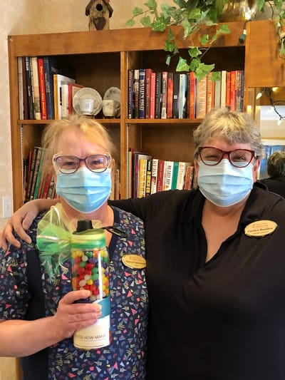 The Inn at Fairview, nursing home in Hudson, NH — Two staff members with a colorful treat jar