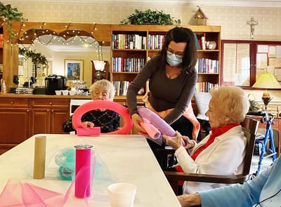 The Inn at Fairview, nursing home in Hudson, NH — Residents engaged in a craft activity with colorful ribbons