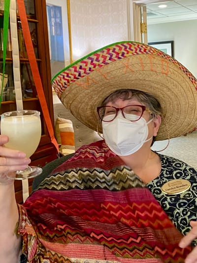 The Inn at Fairview, nursing home in Hudson, NH — Resident celebrating with a drink and festive hat