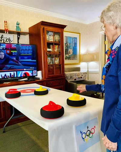 The Inn at Fairview, nursing home in Hudson, NH — Senior resident participating in a curling activity