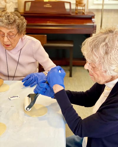 The Inn at Fairview, nursing home in Hudson, NH — Seniors crafting together at a dining table
