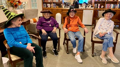 The Inn at Fairview, nursing home in Hudson, NH — Seniors wearing festive hats during a social gathering