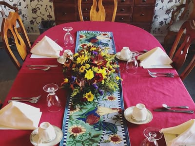 The Inn at Fairview, nursing home in Hudson, NH — Dining table set with floral centerpiece and tableware