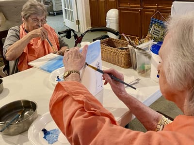 The Inn at Fairview, nursing home in Hudson, NH — Seniors engaged in a painting activity at a table