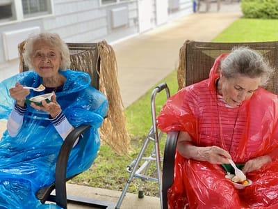 The Inn at Fairview, nursing home in Hudson, NH — Two seniors enjoying ice cream on a porch