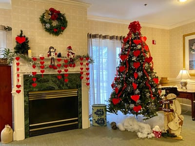 The Inn at Fairview, nursing home in Hudson, NH — Festive holiday decorations with a Christmas tree and mantle