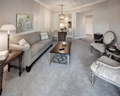 A cozy living room interior of a senior living facility
