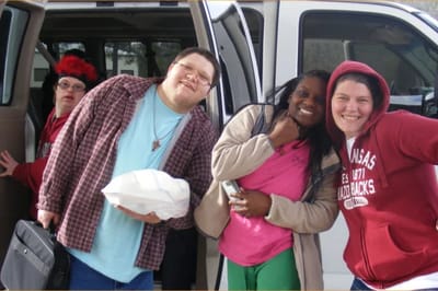 Pathfinder, Inc. Longwood ICF/IID, assisted living in Searcy, AR — Group of individuals smiling near a van