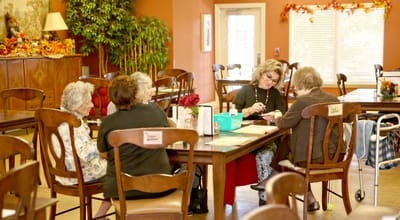 Residents and staff engaged in an activity in a common area